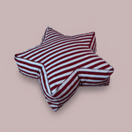 Star-shaped floor cushion for kids featuring bold vertical light blue, burgundy, and white stripes. Large Superstar Crash Pad on a neutral studio background.